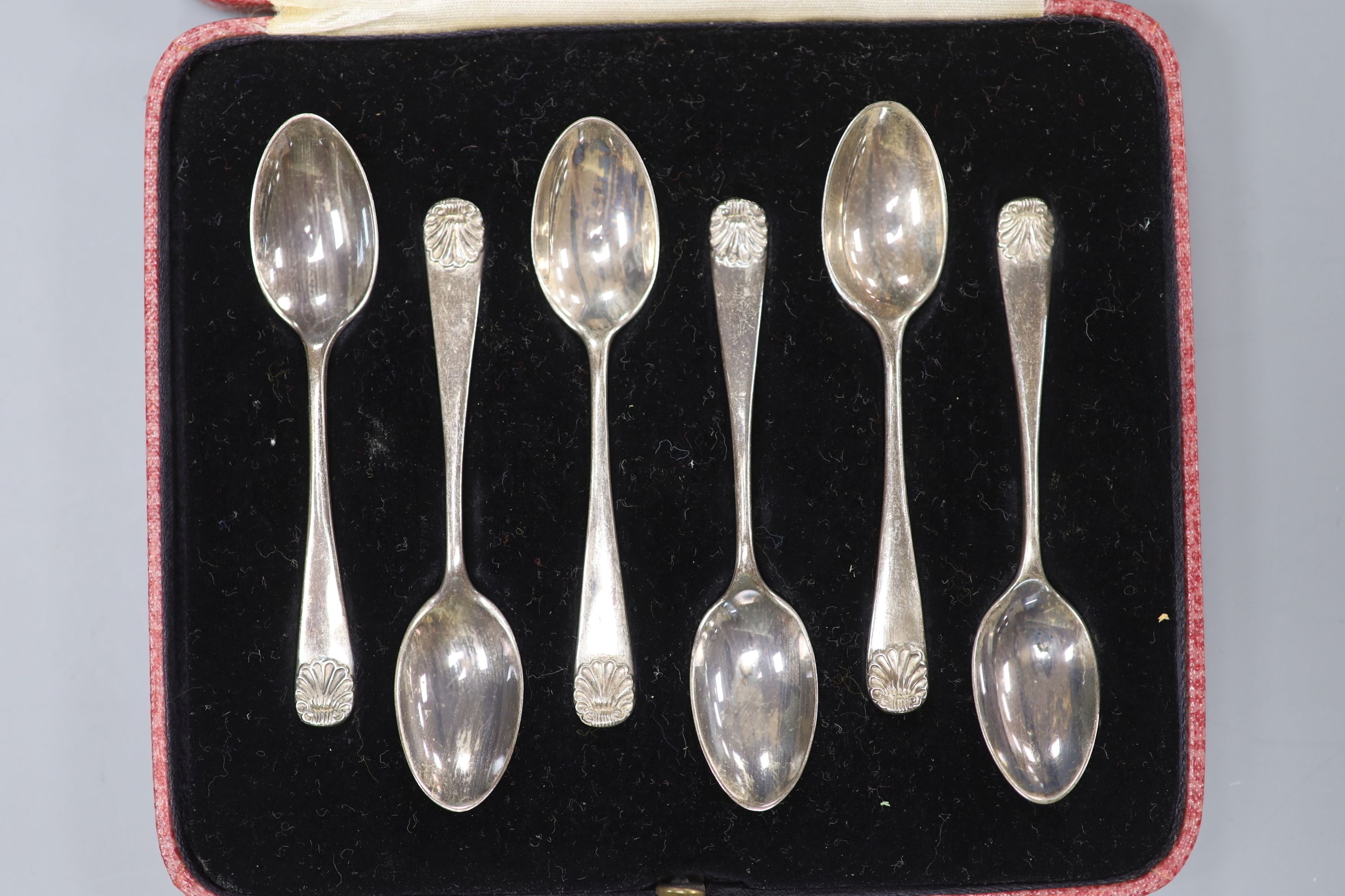 Two similar George III silver berry spoons, London, 1805 & 1814 and a cased set of six silver coffee spoons.